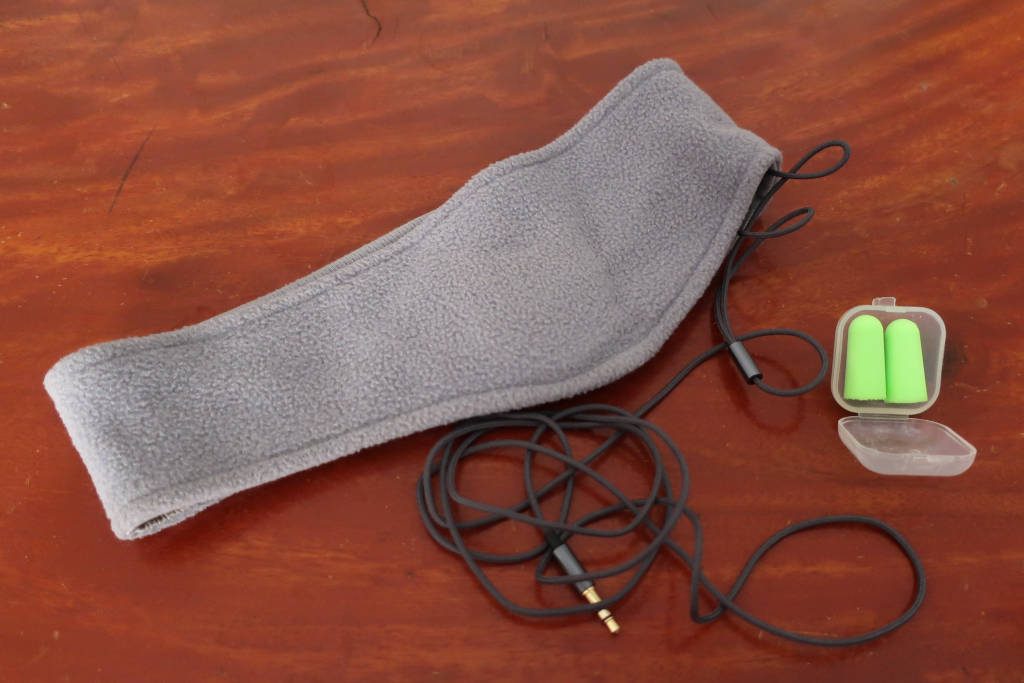 Headband headphones plus earplugs against barking dogs